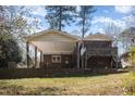 Expansive backyard with a covered patio and screened porch, ideal for entertaining and outdoor activities at 615 Sloan Dr, Cary, NC 27511