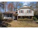 Charming two-story home featuring a classic exterior with a mix of siding and brick accents at 615 Sloan Dr, Cary, NC 27511