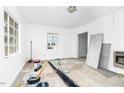 Bright living room with white walls and a large window for natural light at 740 Long Ave, Rocky Mount, NC 27801
