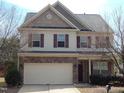 Two-story home featuring brick accents, vinyl siding, dormer and a two car garage at 78 Florence Dr, Clayton, NC 27527