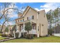 Lovely home featuring a well-maintained lawn and inviting architectural details at 102 Switchback St, Knightdale, NC 27545