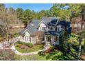 Beautiful home with lush landscaping, a large driveway, and well-maintained surroundings at 1321 Colonial Club Rd, Wake Forest, NC 27587