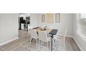 Cozy dining area featuring a modern table set with seating for six, complemented by stylish decor at 175 Gill Farm Way, Franklinton, NC 27525