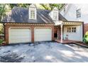 Spacious two car garage with driveway, stylish windows and covered porch at 3005 Woodgreen Dr, Raleigh, NC 27607