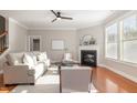 Bright living room with hardwood floors, fireplace, and neutral decor, perfect for relaxation and entertaining at 3910 Wedonia Dr, Cary, NC 27519