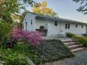 Outdoor patio area with lush landscaping and space for seating at 424 S Greensboro St, Carrboro, NC 27510