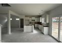 Bright new kitchen with white cabinets and large sliding doors to the backyard at 46 Shortstop Cir, Four Oaks, NC 27524
