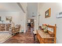 Inviting foyer with hardwood floors and decorative furnishings leads to the living area at 580 Long View Dr, Youngsville, NC 27596
