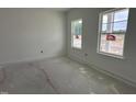Bedroom with two windows letting in natural light at 704 Compeer Way # 28, Rolesville, NC 27571