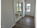 Bright entryway featuring hardwood floors and a glass door with modern finishes at 704 Compeer Way # 28, Rolesville, NC 27571