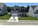 Charming two-story home with a two-car garage and well-manicured lawn at 704 Compeer Way # 28, Rolesville, NC 27571