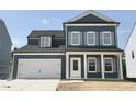 Exterior of a two-story home with blue siding, white trim, shutters, and a two-car garage at 704 Compeer Way # 28, Rolesville, NC 27571