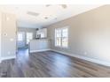 Bright living room featuring hard wood flooring and a view into the kitchen at 818 E Holly St, Rocky Mount, NC 27801