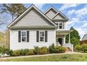 Traditional two-story home with a manicured lawn, classic siding, and black shutters at 101 Lager Ln, Garner, NC 27529