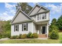 Charming two-story home boasts a manicured lawn and traditional architectural details at 101 Lager Ln, Garner, NC 27529