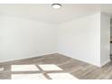 Bright and neutral bedroom offering modern floors, fresh paint, and a serene atmosphere at 1018 Roxboro St, Haw River, NC 27258