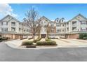 A charming condo complex featuring brick accents and a central courtyard for enhanced curb appeal at 10411 Rosegate Ct # 304, Raleigh, NC 27617