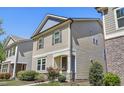Charming two-story home boasts lovely exterior architecture with tasteful landscaping and a welcoming front entrance at 109 Belle Plain Dr, Morrisville, NC 27560