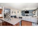 Spacious kitchen overlooks a living area, with hardwood flooring and stainless steel appliances at 1207 Colton Creek Rd, Knightdale, NC 27545