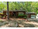 Charming home featuring a well-manicured lawn, brown siding, and a cozy front porch at 1801 Irish Blvd, Sanford, NC 27332