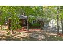 Inviting single-story home with well-kept landscaping, mature trees, and convenient driveway at 1801 Irish Blvd, Sanford, NC 27332