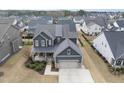 Aerial view of a neighborhood featuring various two-story homes at 1916 Edens Ridge Ave, Wake Forest, NC 27587