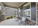 Cozy front porch with seating and stone accents, perfect for enjoying the outdoors at 1916 Edens Ridge Ave, Wake Forest, NC 27587