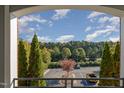 Balcony with a view of lush greenery and trees, offering a serene outdoor space at 201 Finsbury St # 201, Durham, NC 27703