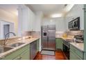 Updated kitchen features granite countertops, stainless steel appliances, and ample cabinet space at 201 Finsbury St # 201, Durham, NC 27703