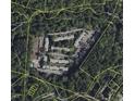 Aerial view showing the layout and surroundings of the property within a wooded area at 220 Elizabeth St # F-2, Chapel Hill, NC 27514