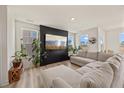 Bright living room featuring modern floors, large windows, stylish decor and comfortable seating at 25 Carlton Ln, Franklinton, NC 27525