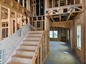 Unfinished staircase featuring wood framing and leading to the second floor at 3015 Dog Rose Drive Lot 170 Dr, Durham, NC 27703