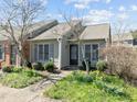 Attractive home with a well-maintained lawn and colorful flowers enhancing the curb appeal at 60 Justin Ct, Durham, NC 27705