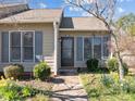 Inviting home exterior featuring a cozy entrance and blossoming flowers in the garden at 60 Justin Ct, Durham, NC 27705