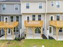 Townhome backyard with patio and deck, offering outdoor living space at 607 Silverado Sunset Loop, Wendell, NC 27591