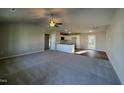 Open concept living room flowing into kitchen with island and modern appliances at 108 Faucette Dr, Selma, NC 27576
