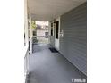 Inviting covered porch with painted floors and walls that add to the home's curb appeal at 1111 Lancaster St, Durham, NC 27701