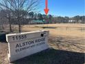 Alston Ridge Elementary school sign, playing fields, and covered picnic area at 1202 Alston Landing Way # 06, Cary, NC 27519