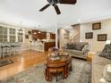 Open-concept living room with hardwood floors, seamlessly connecting to the kitchen at 1428 Heritage Links Dr, Wake Forest, NC 27587