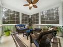 Cozy screened-in porch with comfortable seating and plenty of natural light at 1428 Heritage Links Dr, Wake Forest, NC 27587