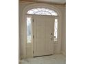 A decorative arched door with sidelights makes an inviting home entrance at 1703 St. Mary'S St, Raleigh, NC 27608