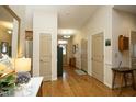 Spacious entry hall featuring hardwood flooring, high ceilings, and ample natural light creating an inviting ambiance at 1914 Tweed Ln, Burlington, NC 27215