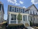 Charming two-story home featuring a welcoming front porch in a residential neighborhood at 1919 Plott Balsam Dr, Wendell, NC 27591
