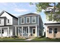 Charming two-story home featuring a welcoming front porch and manicured landscaping at 1919 Plott Balsam Dr, Wendell, NC 27591