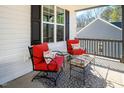 Cozy covered front porch with comfortable seating and charming decor at 271 Sacred Fire Rd, Louisburg, NC 27549
