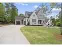 Elegant two-story home boasting a side-entry garage, well-maintained landscaping, and inviting curb appeal at 2829 Theresa Eileen Way, Raleigh, NC 27603
