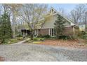 Craftsman-style home featuring brick and shake siding and mature landscaping at 3001 Hunters Bluff Dr, Raleigh, NC 27606