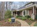 Inviting front yard with lush landscaping, stone walkway, and decorative water feature at 3001 Hunters Bluff Dr, Raleigh, NC 27606