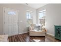 Cozy living room featuring hardwood floors, neutral paint, and bright windows at 3007 Cardinal Lake Dr, Durham, NC 27704