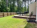 Spacious backyard with a wooden deck, perfect for outdoor entertaining at 303 Fortress Dr, Morrisville, NC 27560